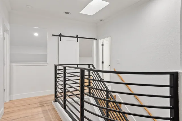 a view of staircase with white walls and a window