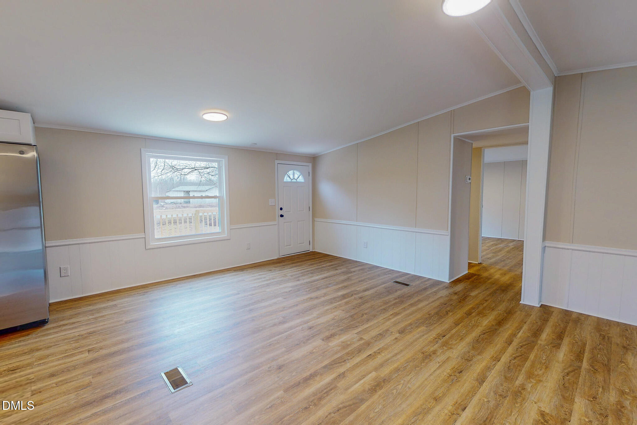 67 Halifax Road Roxboro, NC 27574 - Photo 36 of 48 an empty room with wooden floor and windows