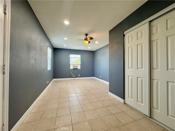 a view of an empty room and window