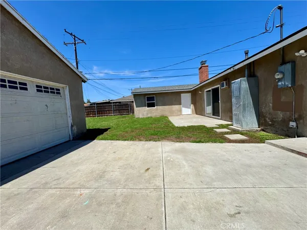 a view of a backyard of the house