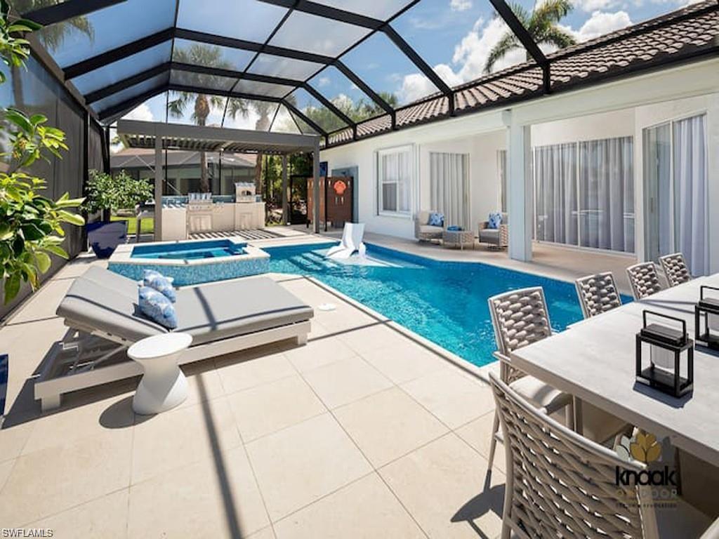 8967 Lely Island Circle Naples, FL 34113 - Photo 3 of 46 a view of a chairs and table in a patio