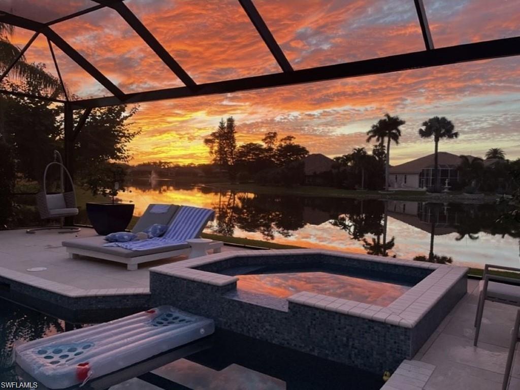 8967 Lely Island Circle Naples, FL 34113 - Photo 6 of 46 a view of a balcony with couches and wooden floor