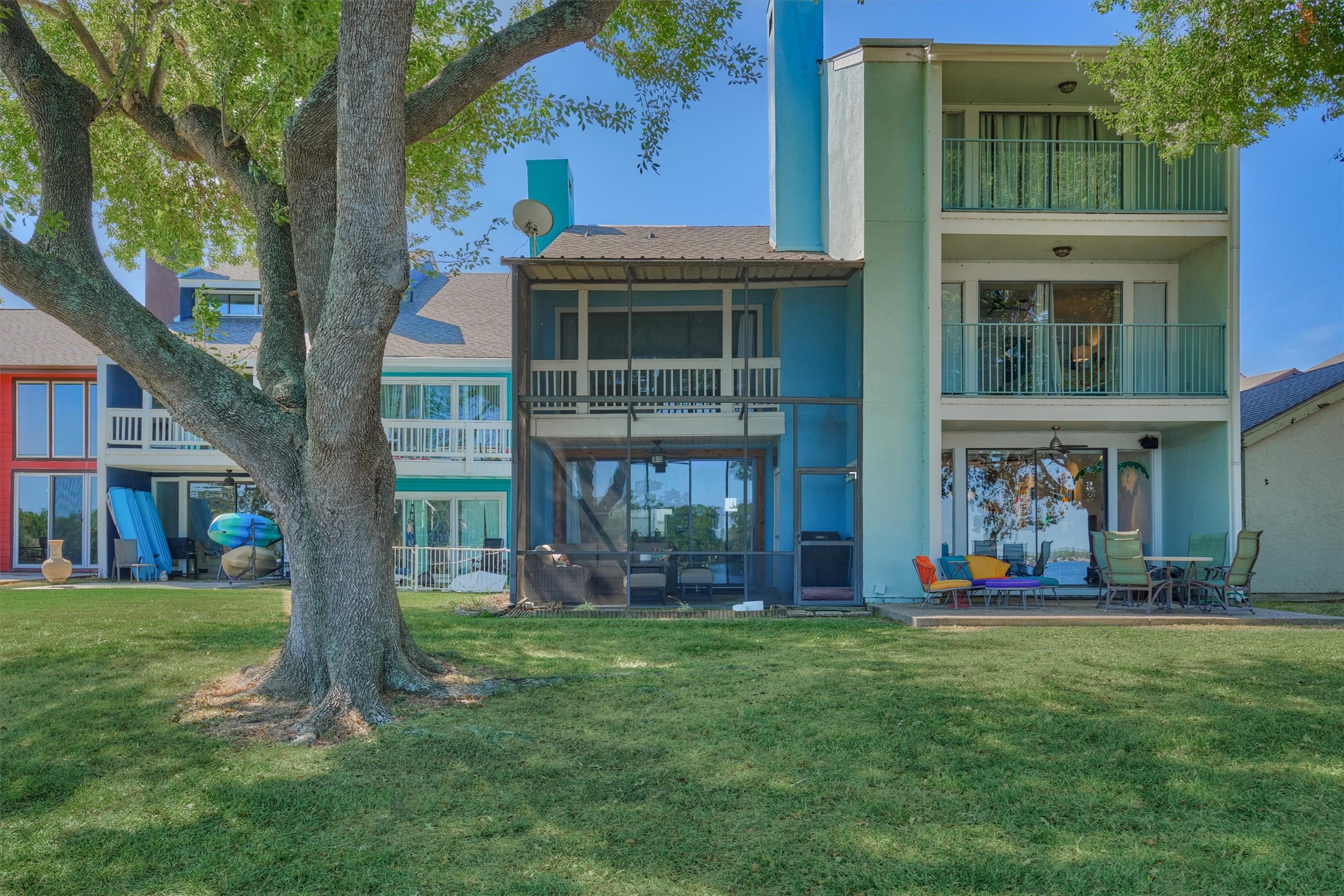 1428 Bowsprit Point Willis, TX 77318 - Photo 40 of 47 A back view of the home with two story screened in porch area.