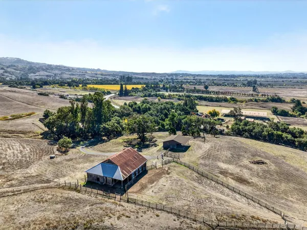 an aerial view of house with yard