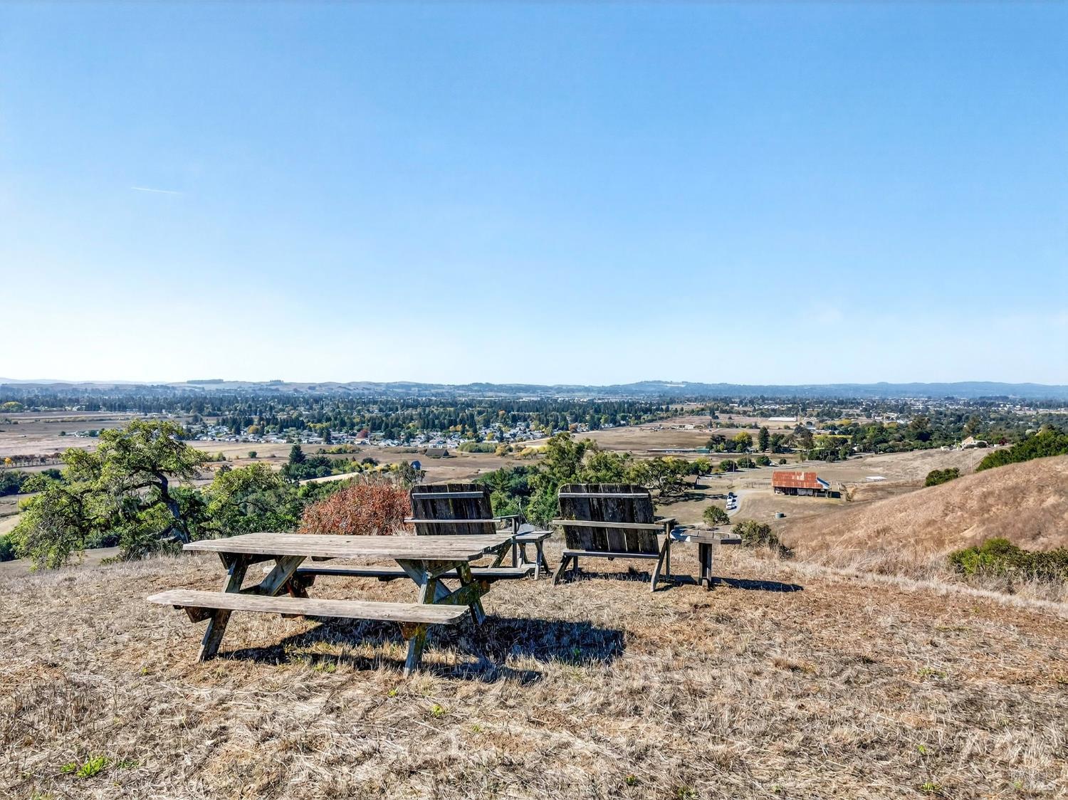 5200 Petaluma Hill Road Santa Rosa, CA 95404 - Photo 36 of 45 a view of a terrace with lawn chairs and wooden floor