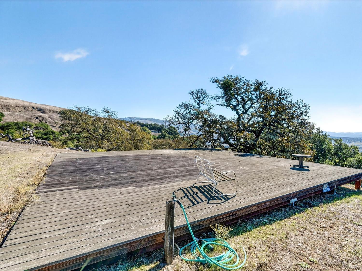 5200 Petaluma Hill Road Santa Rosa, CA 95404 - Photo 43 of 45 a view of a roof deck with wooden floor and fence
