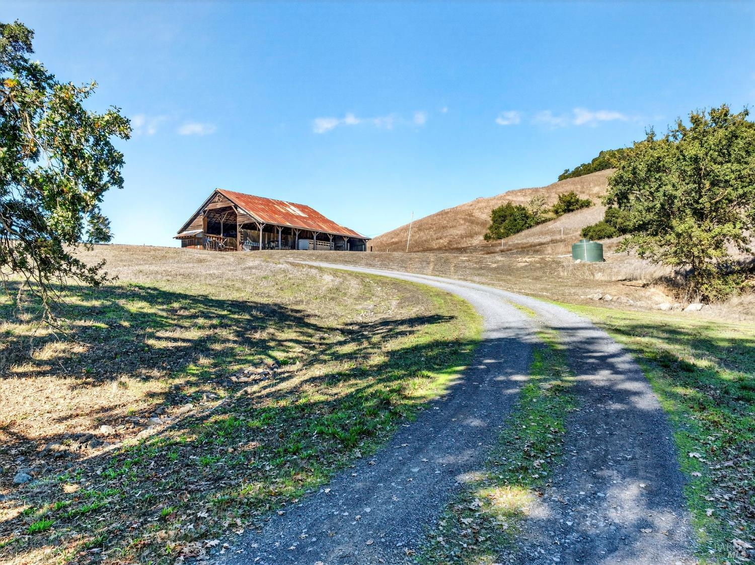 5200 Petaluma Hill Road Santa Rosa, CA 95404 - Photo 5 of 45 a view of a field with a tree in the background