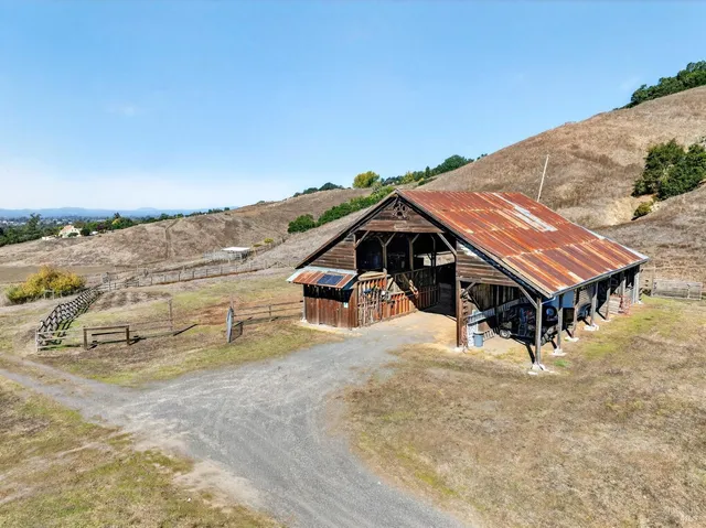 an aerial view of a chairs and table on the terrace