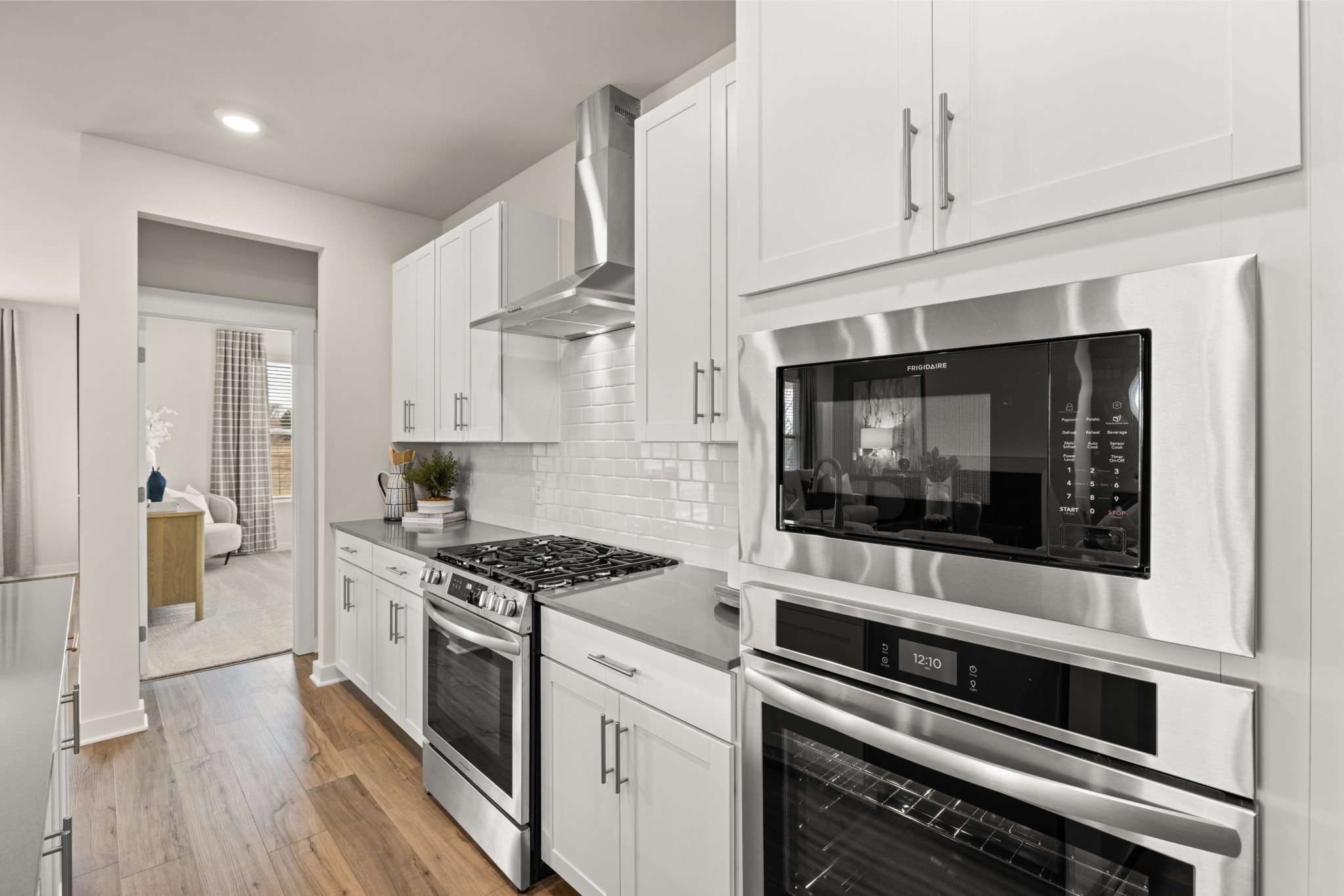 6352 North New Hope Road Hermitage, TN 37076 - Photo 11 of 52 a kitchen with stainless steel appliances a stove microwave and cabinets