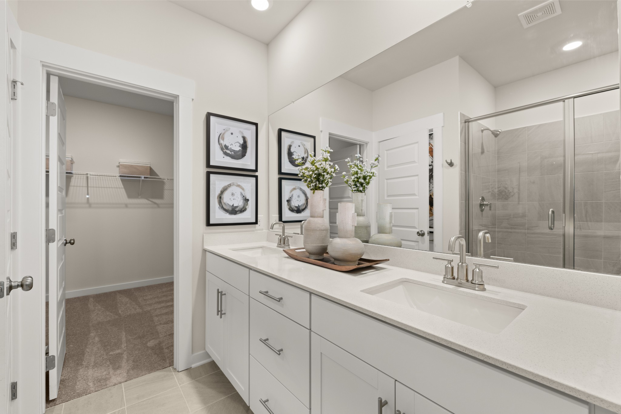 6352 North New Hope Road Hermitage, TN 37076 - Photo 28 of 52 a bathroom with double vanity sinks and a shower