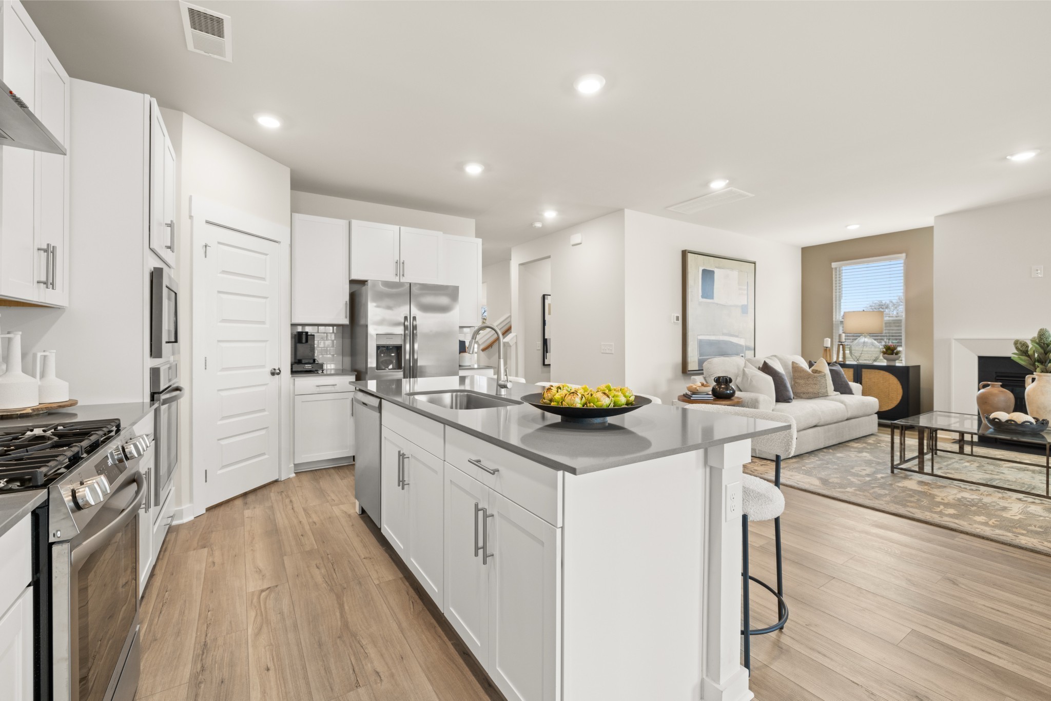 6352 North New Hope Road Hermitage, TN 37076 - Photo 8 of 52 a kitchen that has a lot of white cabinets and stainless steel appliances