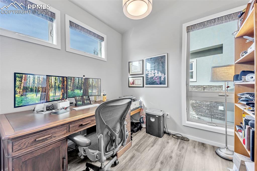 414 Eclipse Drive Colorado Springs, CO 80905 - Photo 17 of 50 Home office with baseboards and light wood-style floors