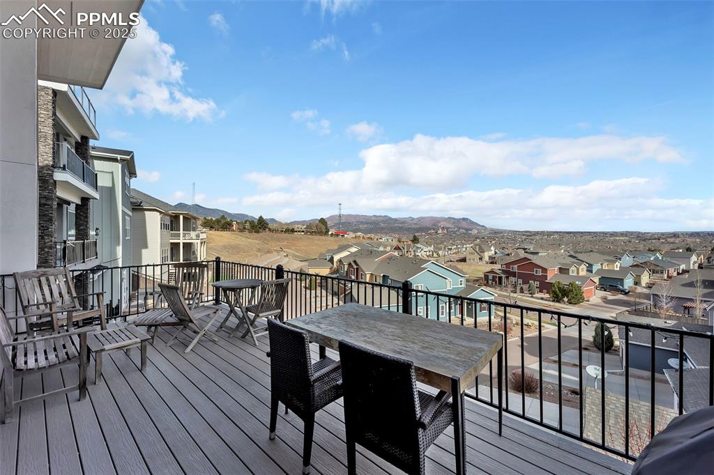 414 Eclipse Drive Colorado Springs, CO 80905 - Photo 24 of 50 Deck featuring a mountain view and a residential view