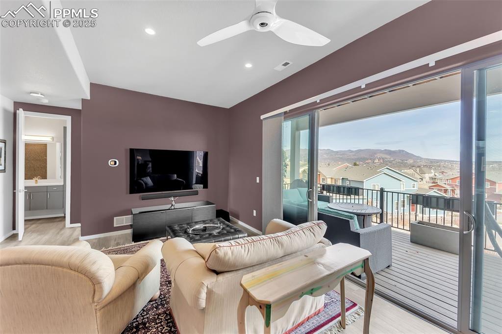 414 Eclipse Drive Colorado Springs, CO 80905 - Photo 31 of 50 Living area featuring recessed lighting, baseboards, light wood finished floors, ceiling fan, and visible vents