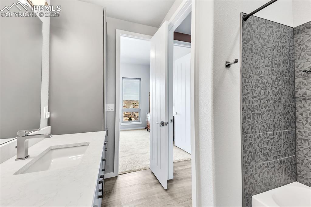 414 Eclipse Drive Colorado Springs, CO 80905 - Photo 38 of 50 Full bath with wood finished floors, vanity, and shower / washtub combination