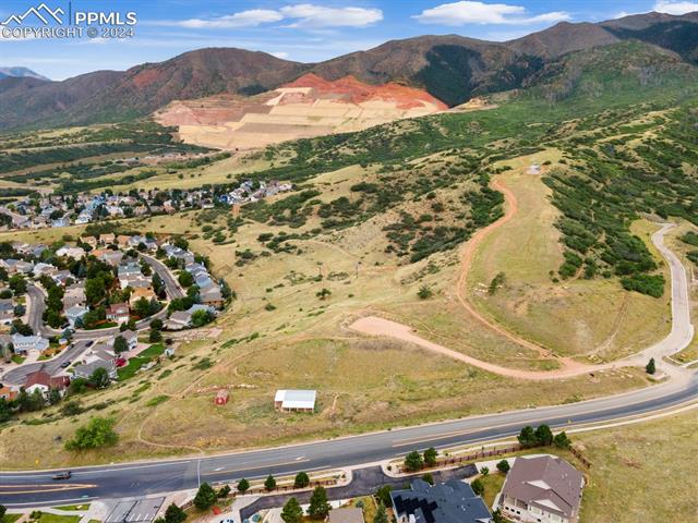 7730 Julynn Road Colorado Springs, CO 80919 - Photo 44 of 48 Birds eye view of property featuring a mountain view