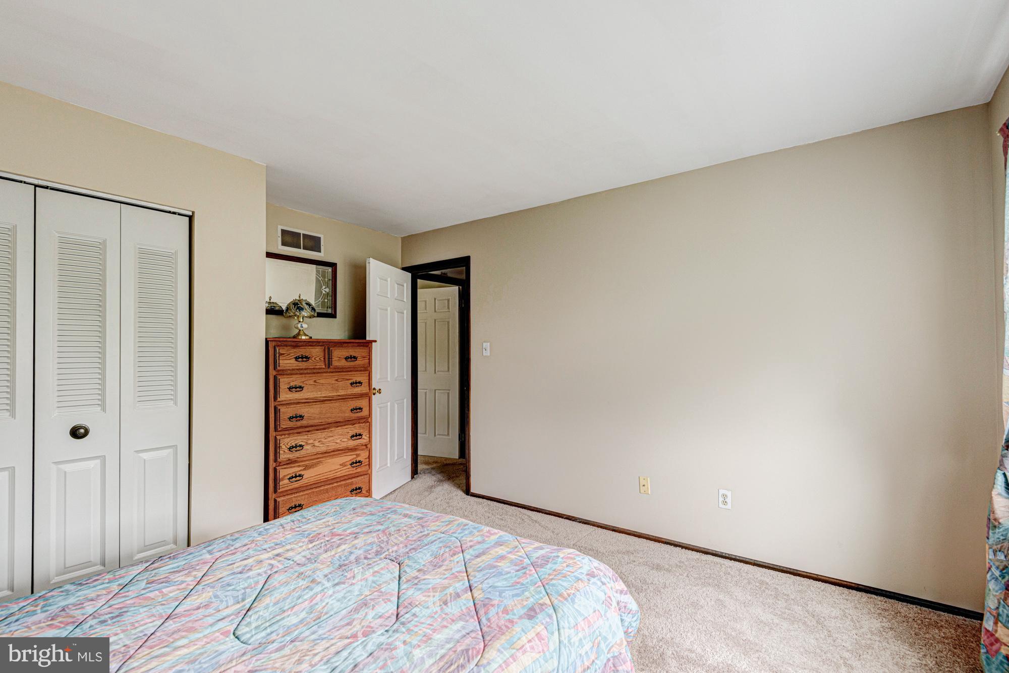 8 Risa Court Newark, DE 19702 - Photo 56 of 58 a bedroom with a bed and a closet