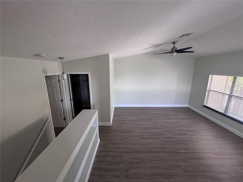 1755 Highland Road Osprey, FL 34229 - Photo 13 of 31 wooden floor in an empty room with a window
