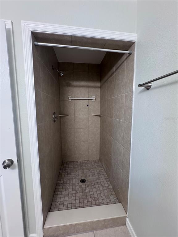 1755 Highland Road Osprey, FL 34229 - Photo 21 of 31 a bathroom with a glass door shower
