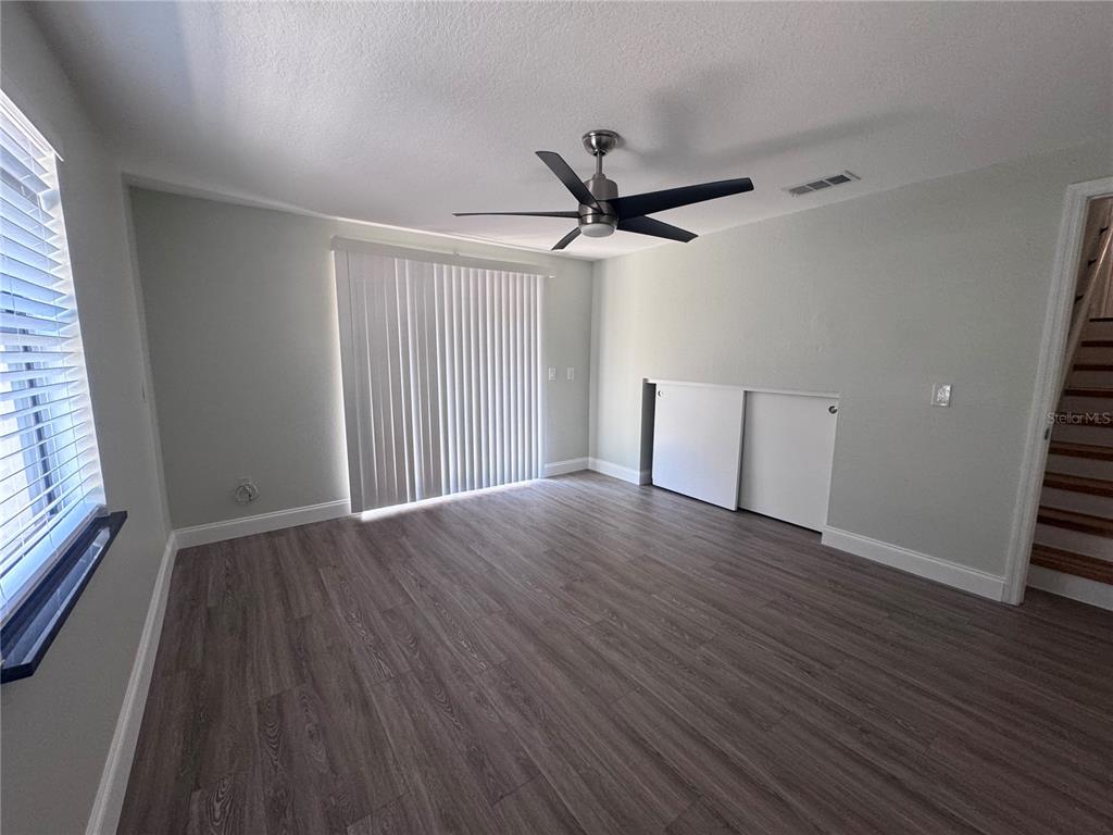 1755 Highland Road Osprey, FL 34229 - Photo 27 of 31 an empty room with wooden floor and windows