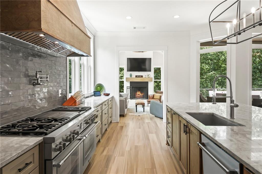 6014 Warpath Road Flowery Branch, GA 30542 - Photo 15 of 36 a kitchen with sink stove and refrigerator
