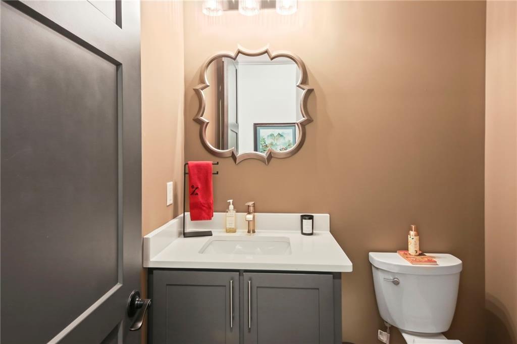 6014 Warpath Road Flowery Branch, GA 30542 - Photo 20 of 36 a bathroom with a sink and a mirror