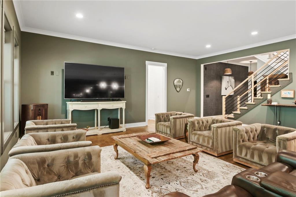 6014 Warpath Road Flowery Branch, GA 30542 - Photo 26 of 36 a living room with furniture and a flat screen tv