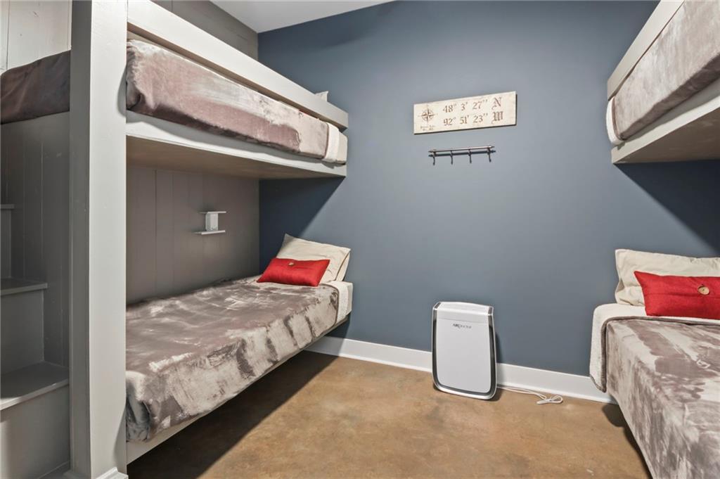 6014 Warpath Road Flowery Branch, GA 30542 - Photo 29 of 36 a bedroom with bed and a window