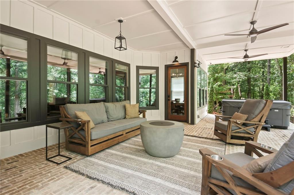 6014 Warpath Road Flowery Branch, GA 30542 - Photo 32 of 36 a living room with furniture and a large window