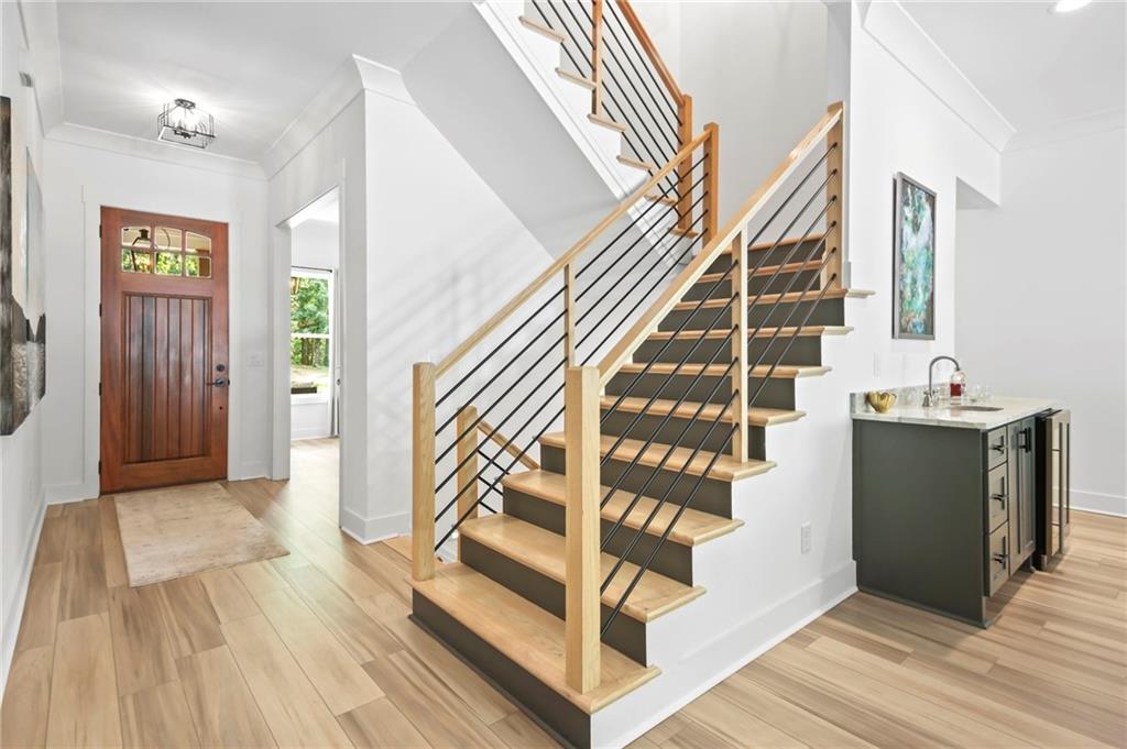 6014 Warpath Road Flowery Branch, GA 30542 - Photo 4 of 36 a view of entryway and hall with wooden floor
