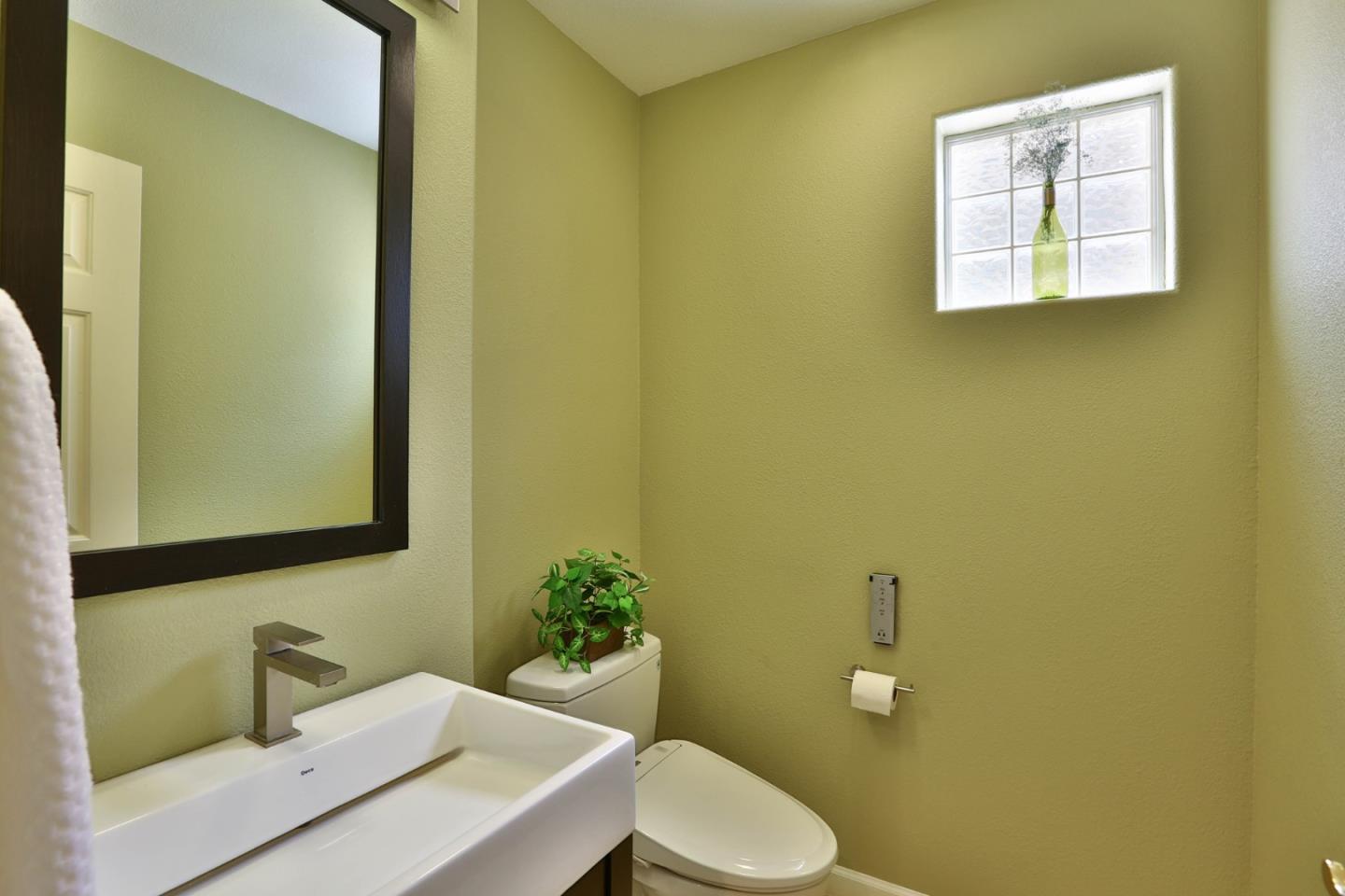 5806 Killarney Circle San Jose, CA 95138 - Photo 11 of 37 a bathroom with a toilet a sink and mirror