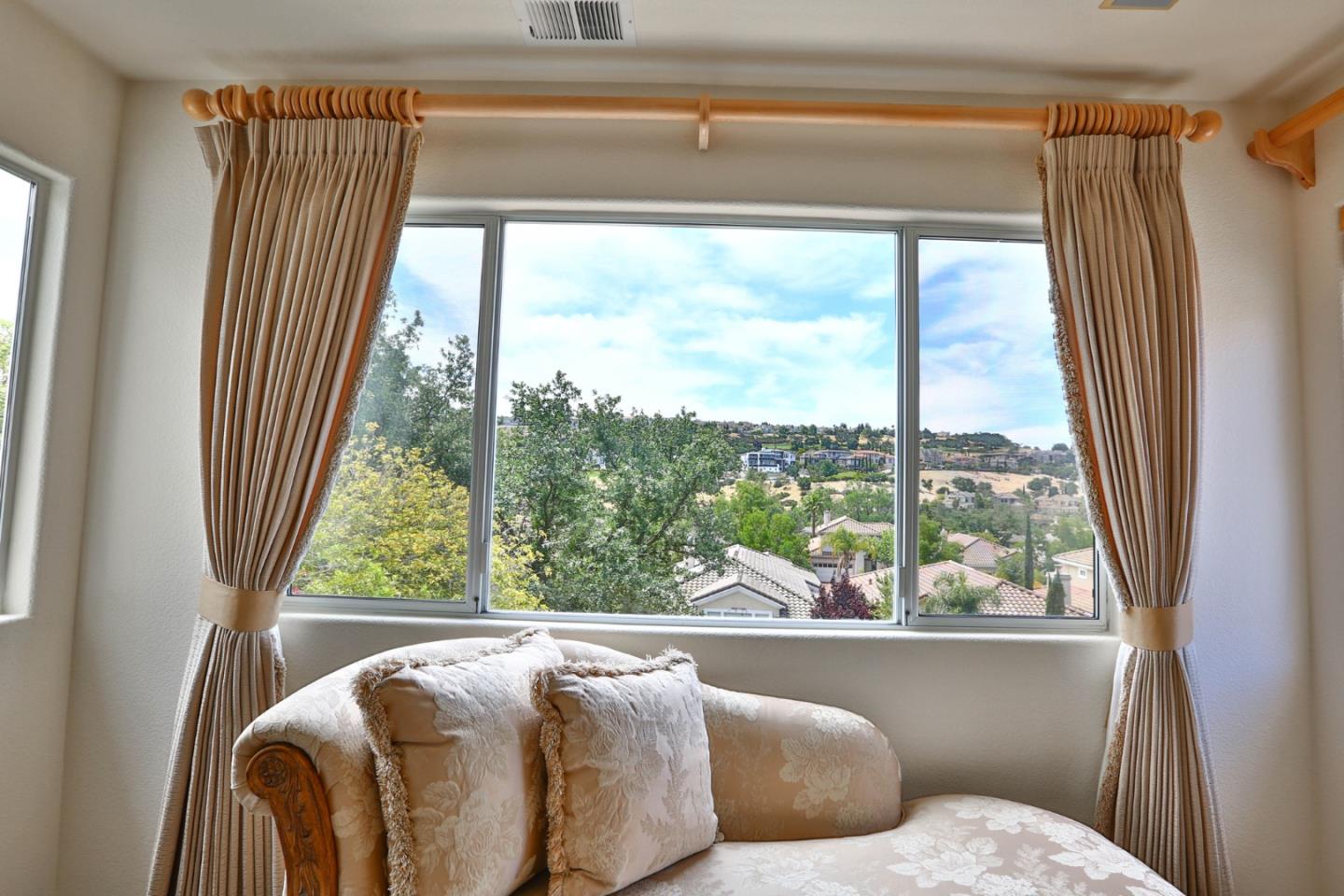 5806 Killarney Circle San Jose, CA 95138 - Photo 15 of 37 a living room with a large window and a bed