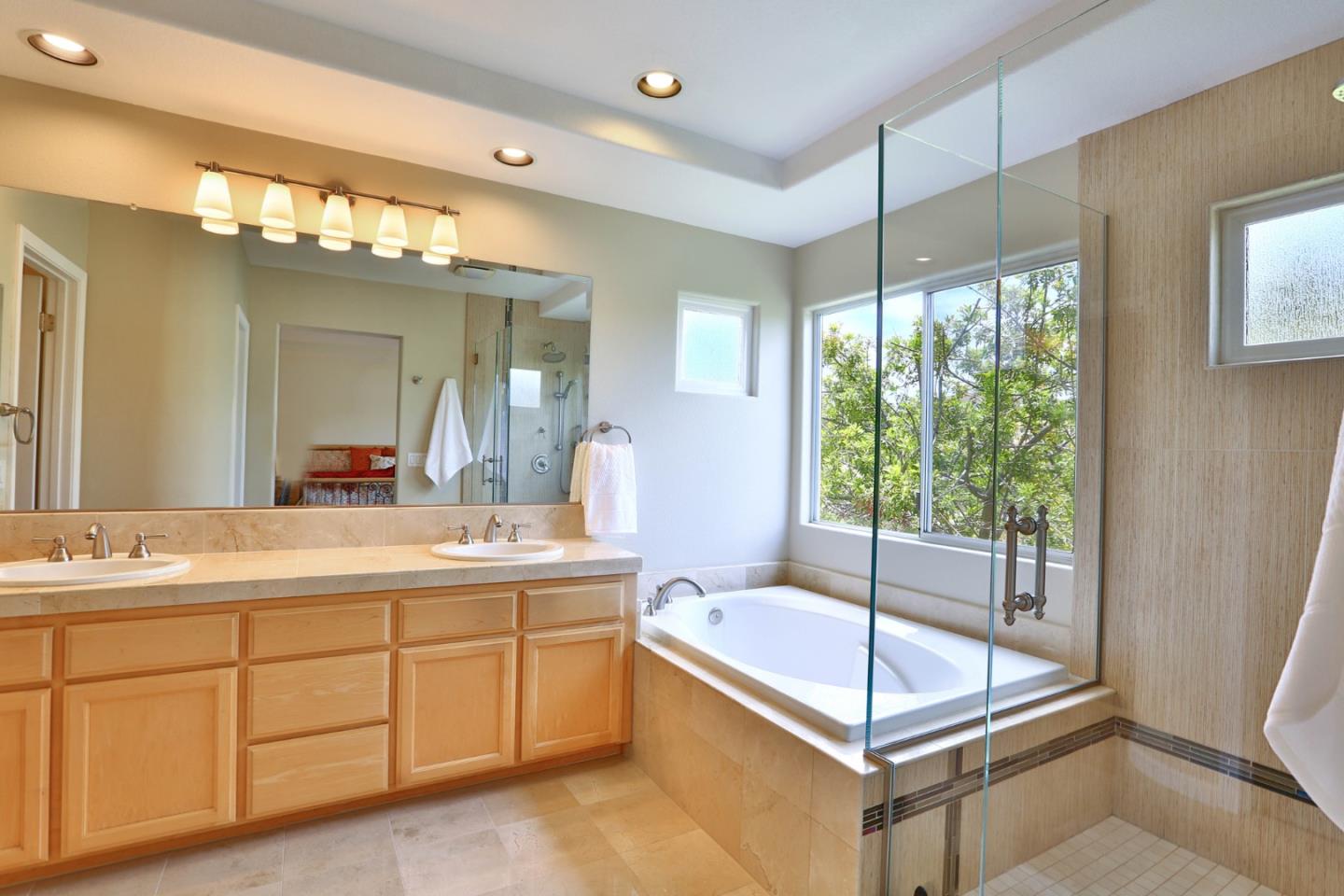 5806 Killarney Circle San Jose, CA 95138 - Photo 16 of 37 a bathroom with a tub sink and mirror