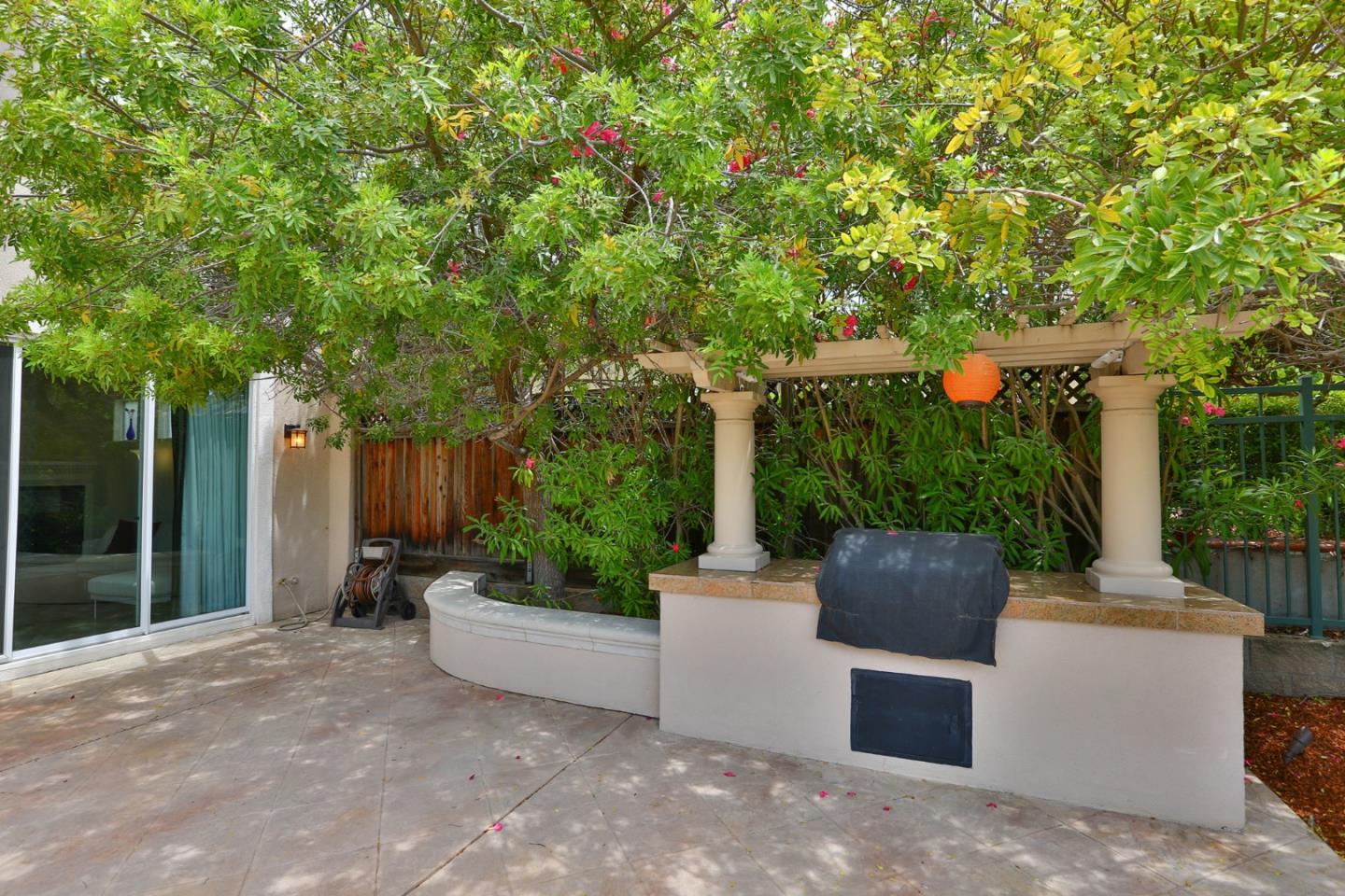5806 Killarney Circle San Jose, CA 95138 - Photo 25 of 37 a view of a patio with couches plants and large trees