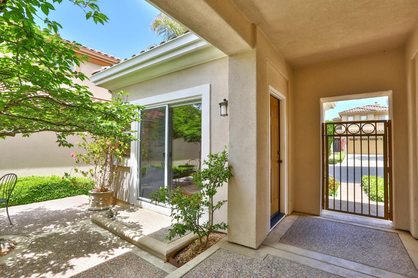 5806 Killarney Circle San Jose, CA 95138 - Photo 27 of 37 a front view of a house with a blue gate