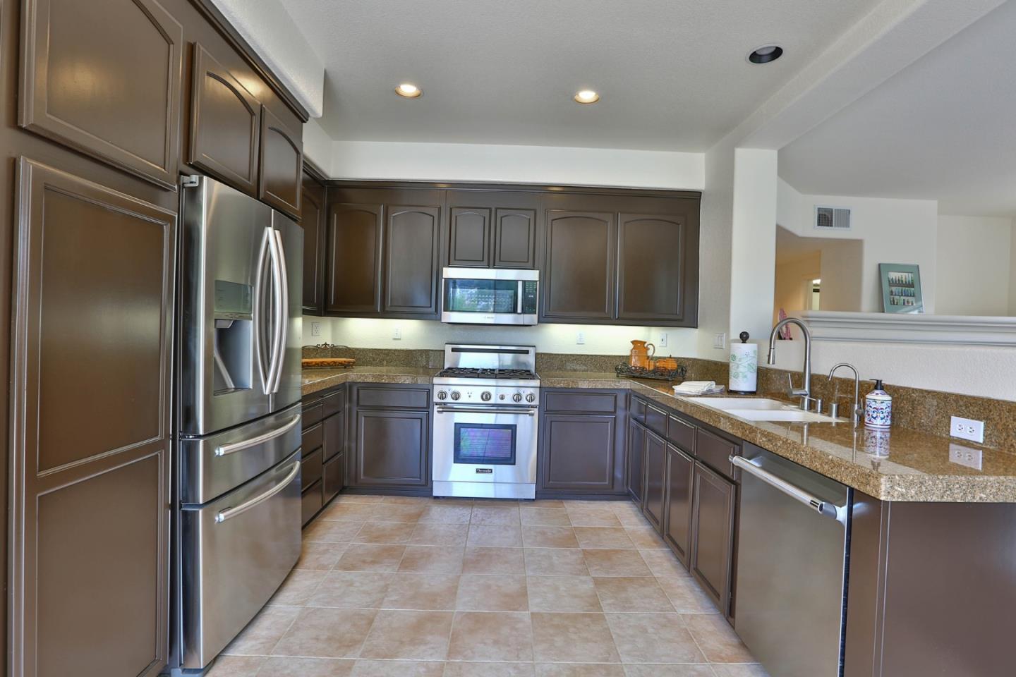 5806 Killarney Circle San Jose, CA 95138 - Photo 8 of 37 a kitchen with stainless steel appliances granite countertop a refrigerator and a sink
