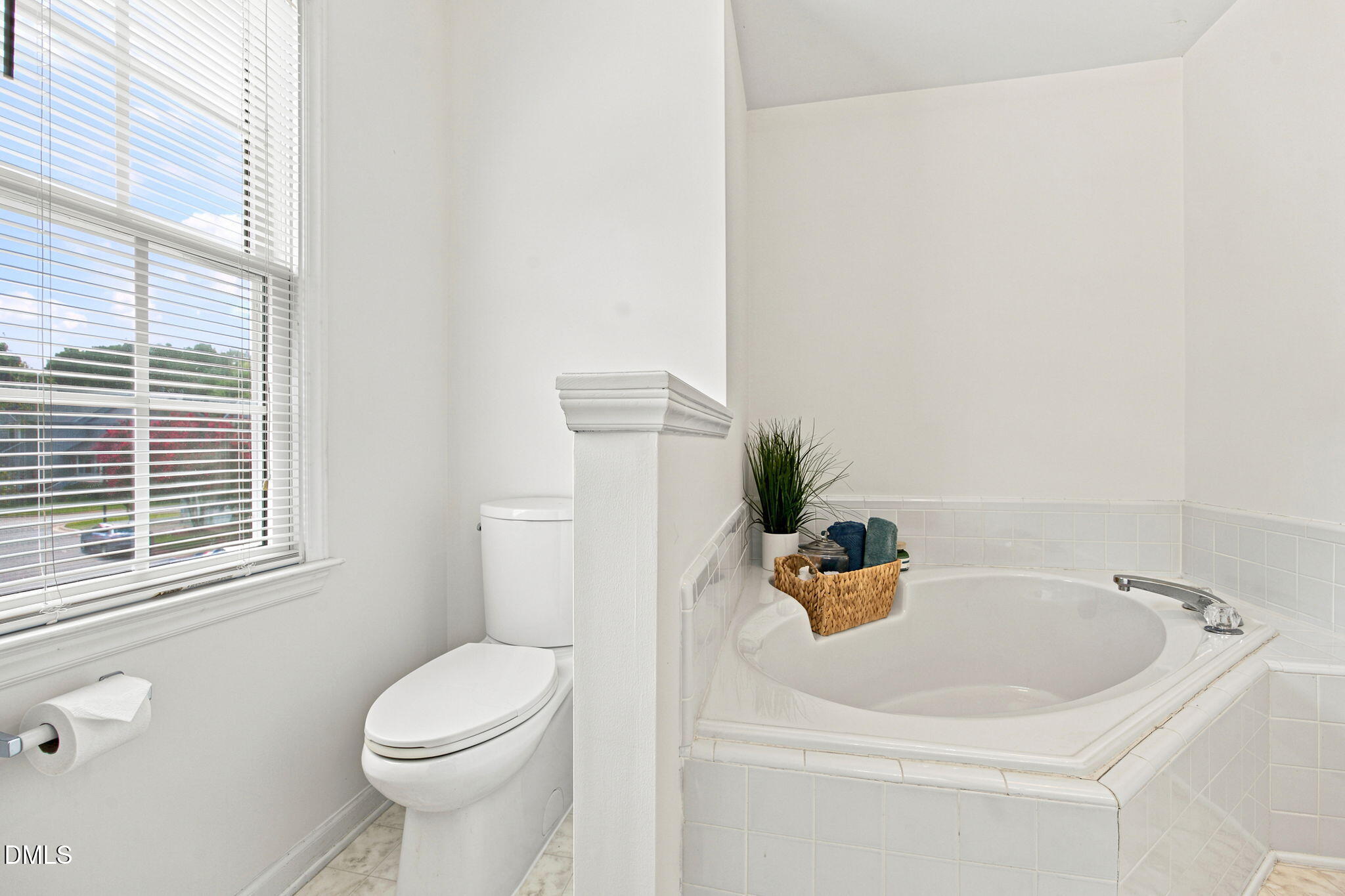 8211 Hempshire Place, Unit 104 Raleigh, NC 27613 - Photo 22 of 34 Corner soaking tub with tile surround