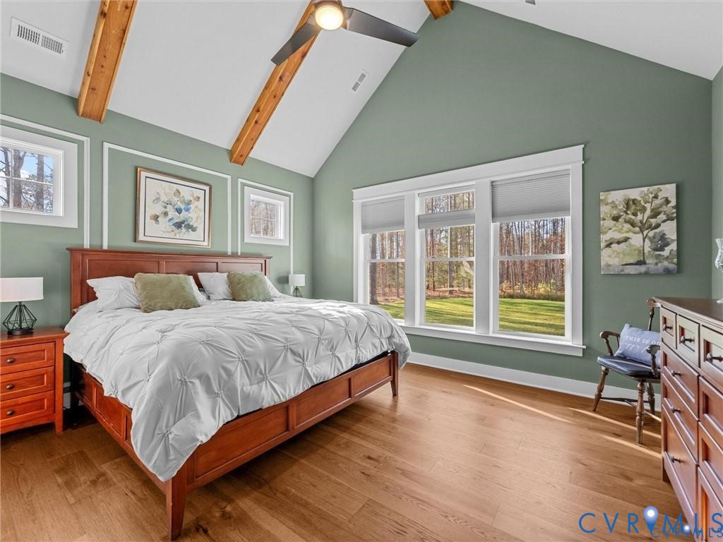 13406 Drake Mallard Court Chesterfield, VA 23838 - Photo 19 of 58 a spacious bedroom with a bed and wooden floor