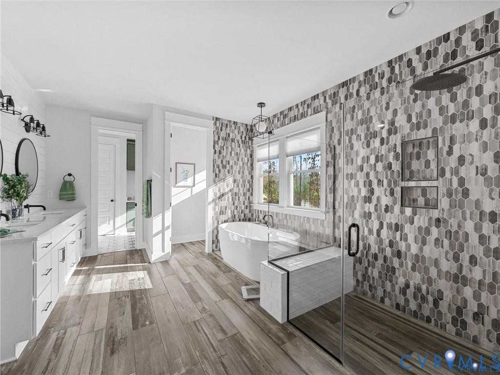 13406 Drake Mallard Court Chesterfield, VA 23838 - Photo 22 of 58 a spacious bathroom with a double vanity sink a mirror and a bathtub