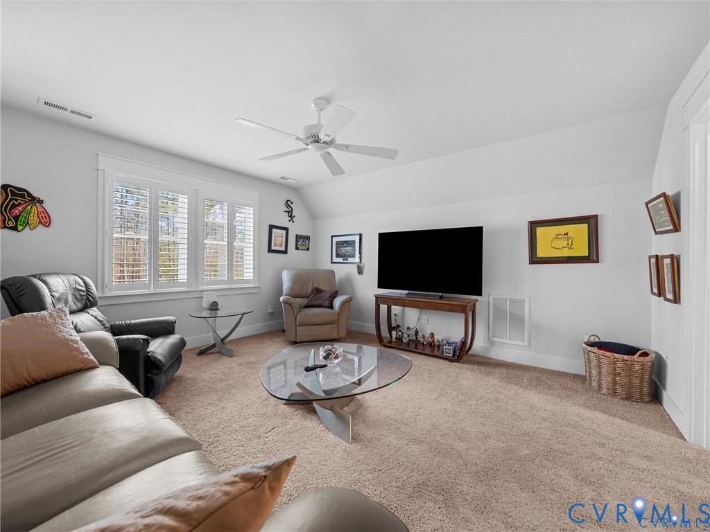 13406 Drake Mallard Court Chesterfield, VA 23838 - Photo 37 of 58 a living room with furniture and a flat screen tv