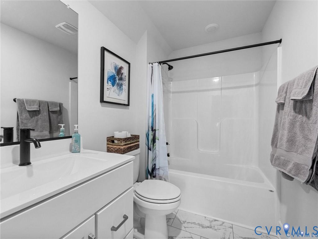 13406 Drake Mallard Court Chesterfield, VA 23838 - Photo 39 of 58 a bathroom with a sink toilet and shower