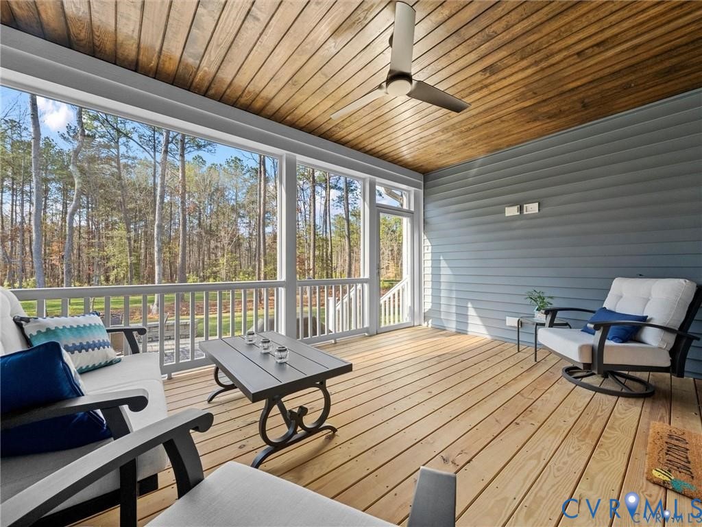 13406 Drake Mallard Court Chesterfield, VA 23838 - Photo 42 of 58 a balcony with furniture and wooden floor