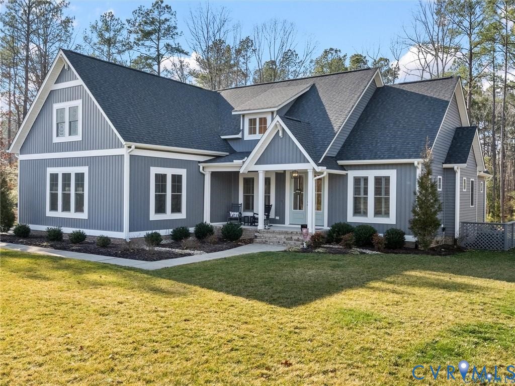 13406 Drake Mallard Court Chesterfield, VA 23838 - Photo 45 of 58 a front view of a house with swimming pool having outdoor seating
