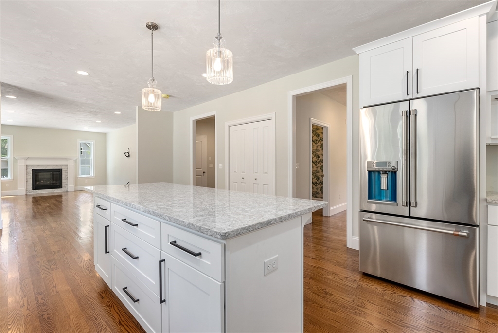 Lot 1 Quinn Road Marlborough, MA 01752 - Photo 14 of 26 a kitchen with stainless steel appliances granite countertop a refrigerator a sink and a refrigerator