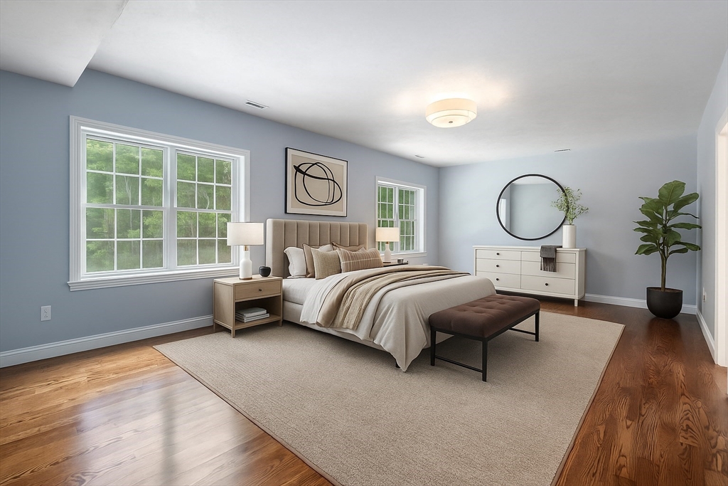 Lot 1 Quinn Road Marlborough, MA 01752 - Photo 16 of 26 a bedroom with a bed a potted plant and a large window with outer view