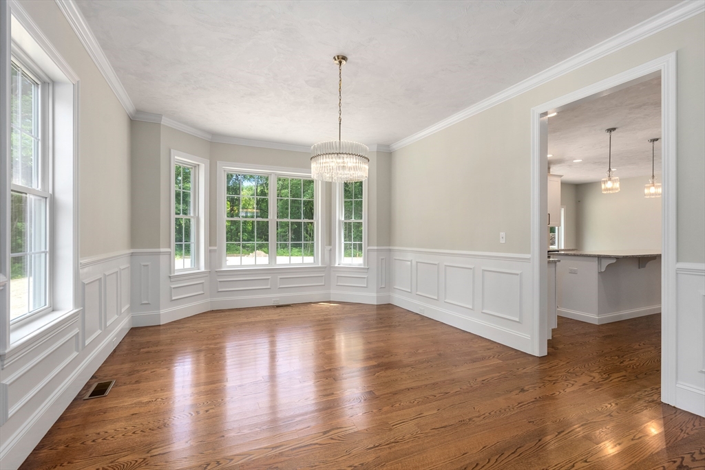 Lot 1 Quinn Road Marlborough, MA 01752 - Photo 5 of 26 a view of an empty room with wooden floor and a window
