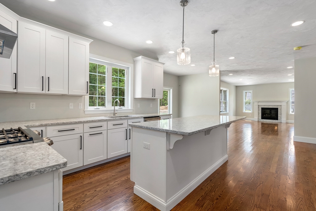 Lot 1 Quinn Road Marlborough, MA 01752 - Photo 8 of 26 a large kitchen with lots of counter space a sink appliances and cabinets