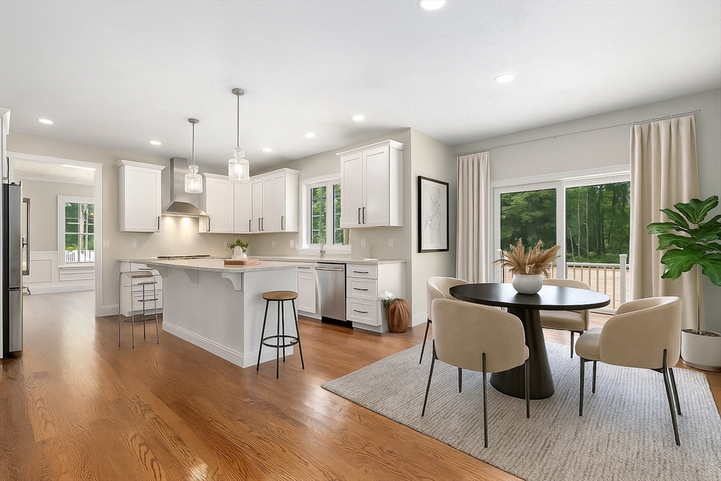 Lot 1 Quinn Road Marlborough, MA 01752 - Photo 9 of 26 a kitchen with a table chairs refrigerator and cabinets