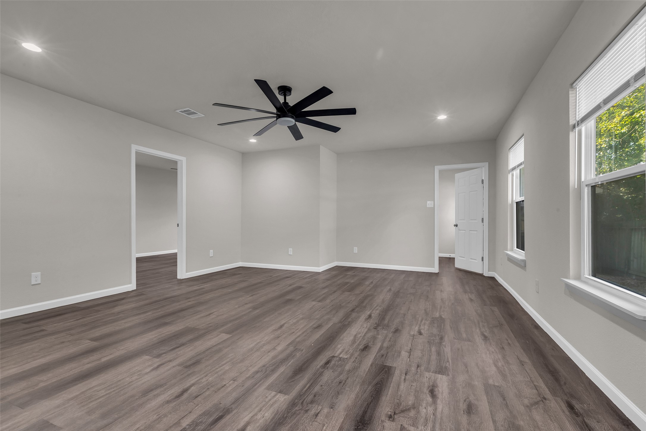 116 Gans Street Houston, TX 77029 - Photo 13 of 25 an empty room with wooden floor and windows