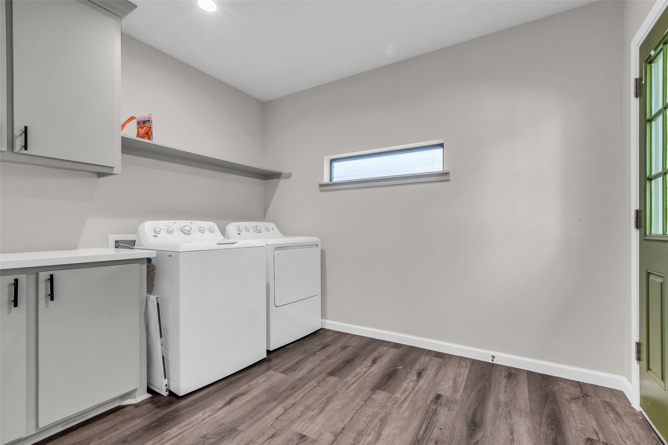 116 Gans Street Houston, TX 77029 - Photo 14 of 25 a utility room with wooden floor cabinetry